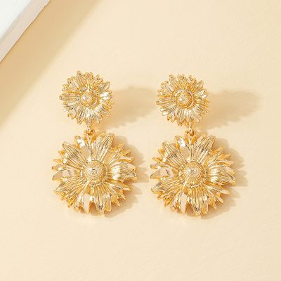 Elegant flower-shaped gold earrings for women, perfect for fashion accessories and jewelry collections. Bright, trendy, and stylish floral statement earrings.