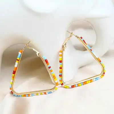 Bright beaded hoop earrings with multicolored beads, perfect for trendy fashion and casual wear. Made with durable materials to enhance your style effortlessly.