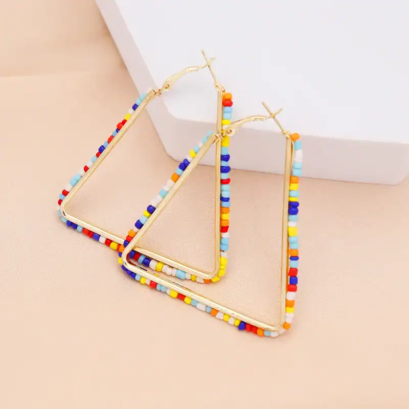 Vibrant beaded hoop earrings with multicolored beads, perfect for casual or trendy outfits. Made with high-quality materials, lightweight, and comfortable for everyday wear.