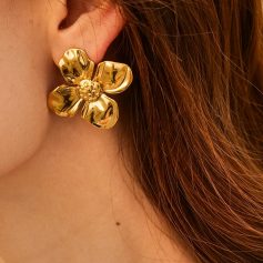Close-up of a stunning gold flower-shaped earring designed for women, emphasizing stylish jewelry.