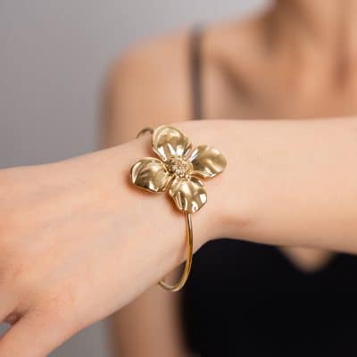 Luxurious gold flower bracelet with intricate detailing, perfect for stylish women seeking designer jewelry from Monalisa Medical.