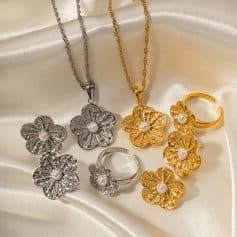 Exquisite gold and silver flower jewelry with pearl accents, including necklaces, earrings, and rings, perfect for special occasions and everyday elegance.