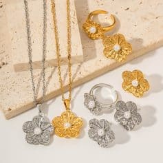 Stylish women's jewelry including gold and silver floral necklaces, rings, and earrings featuring pearl details, perfect for fashion and accessory shopping at Monalisa Store.