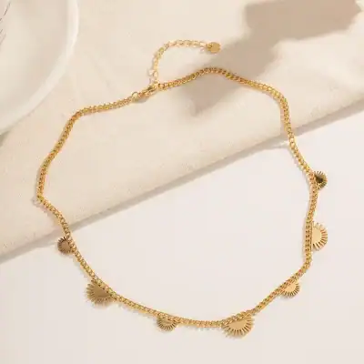 Delicate gold chain necklace with sun-shaped charms, perfect for stylish accessories and jewelry lovers. Ideal for enhancing your look with a touch of sunshine and elegance.