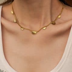 Gold sun-shaped charm jewelry for women, stylish and trendy design, perfect for accessories and gift ideas.