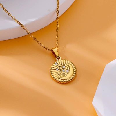 Stunning gold necklace featuring a crescent moon and starburst design adorned with sparkling diamonds, ideal for elegant jewelry lovers. Perfect for special occasions or everyday luxury wear.