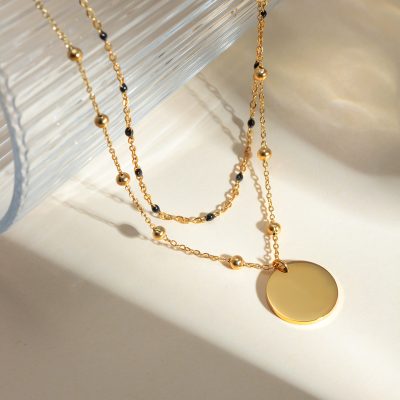 Delicate gold necklace featuring black beads, perfect for women’s fashion accessories. Shop stylish, high-quality jewelry online at Monalisa Store for elegant and trendy looks.
