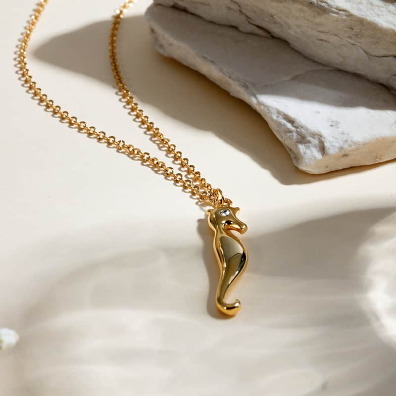 Luxury gold seahorse jewelry for women, stylish and elegant gold pendant necklace. Enhance your jewelry collection with high-quality, trendy statement pieces from Monalisa Store.