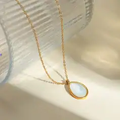 Luxurious gold chain with oval mother-of-pearl pendant, perfect for stylish jewelry lovers. Ideal for enhancing your fashion statement and special occasions.