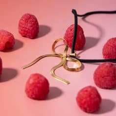 Delicate gold necklace and earrings with raspberry elements, showcasing stylish jewelry at Monalisa Store, perfect for fashion-forward accessories and jewelry shopping.