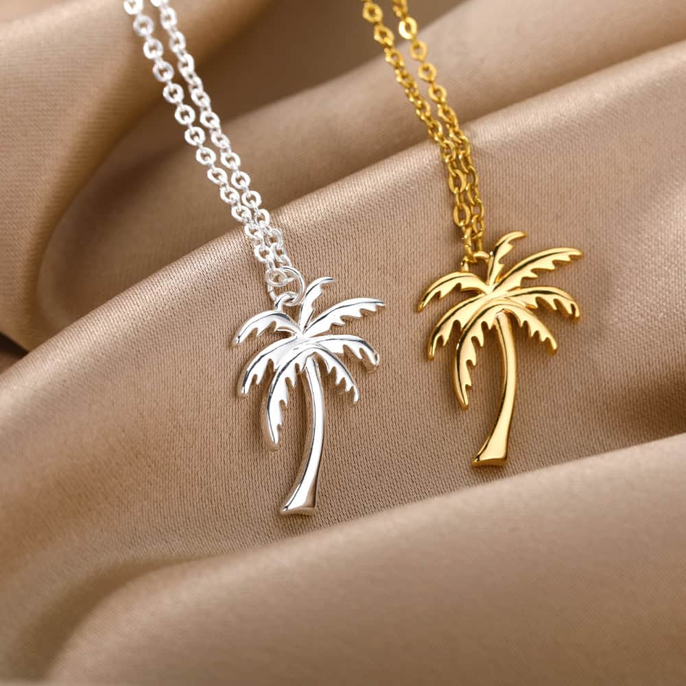 Deluxe palm tree pendant necklaces in gold and silver, perfect for summer and beach-themed accessories. Made of high-quality, stylish material, ideal for casual or elegant wear, showcasing timeless tropical charm.