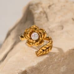 Luxurious gold ring featuring a detailed flower design with a central pearl, perfect for stylish women seeking high-quality jewelry.