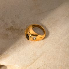 Elegant gold ring featuring black and clear gemstones, perfect for stylish accessories and jewelry collection. Crafted with high-quality materials, suitable for special occasions.