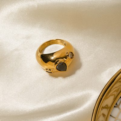 Elegant gold ring with black and clear gemstones, luxury jewelry, perfect for fashion-forward accessories and stylish gifting options.