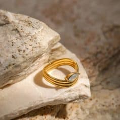 Luxurious gold ring with diamond accent, showcased on textured stone for a sophisticated look. Ideal for gifting or everyday elegance, available now at Monalisa Store for premium jewelry shoppers.