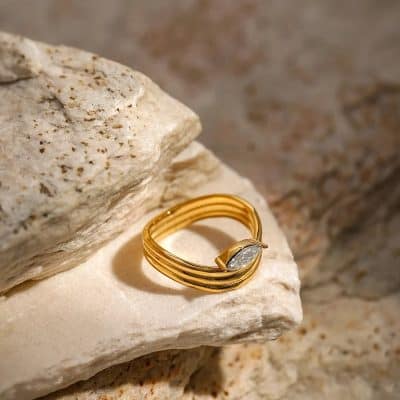 Luxurious gold ring with diamond accent, showcased on textured stone for a sophisticated look. Ideal for gifting or everyday elegance, available now at Monalisa Store for premium jewelry shoppers.