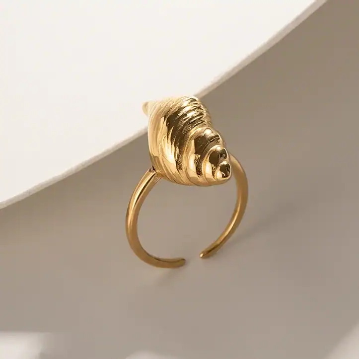 Deluxe gold shell-shaped ring perfect for stylish and sophisticated jewelry collections and accessories.