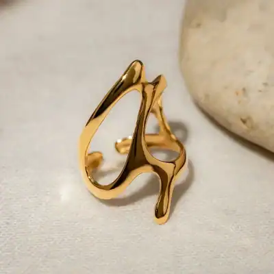 Stunning gold fashion ring featuring smooth, flowing curves perfect for stylish accessories and jewelry lovers. Ideal for gifting or personal collection enhancement.