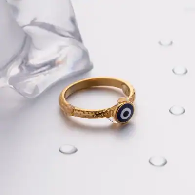 Gold evil eye ring with textured band, protective jewelry for good luck, fashion accessory, daily wear, spiritual protection, elegant gold jewelry.