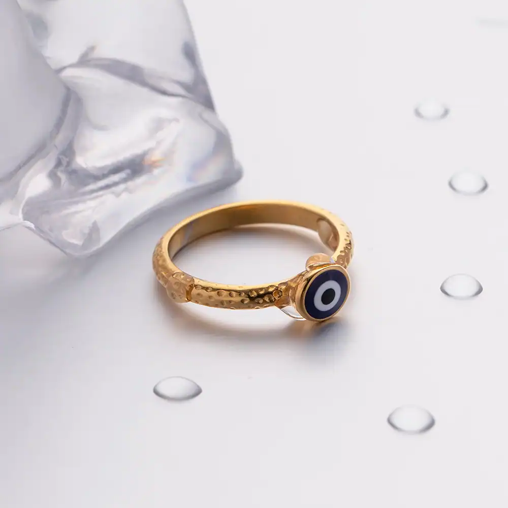 Gold evil eye ring with textured band, protective jewelry for good luck, fashion accessory, daily wear, spiritual protection, elegant gold jewelry.