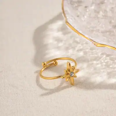 A stunning gold flower-shaped ring featuring a sparkling crystal, perfect for elegant jewelry collection. Ideal for women's fashion accessories, gift giving, or everyday wear.