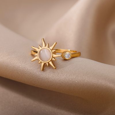 Elegant gold sun-shaped pearl ring with diamond accent, perfect for stylish women. Crafted with high-quality materials, ideal for jewelry lovers seeking unique accessory pieces.