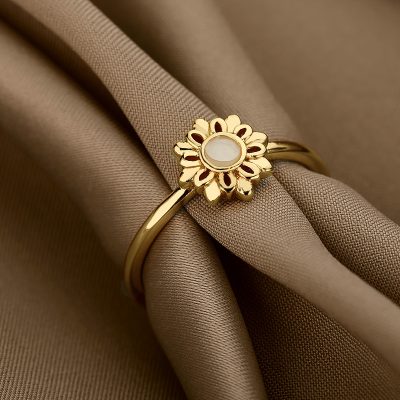 Gold flower-shaped ring with a central white stone, perfect for stylish accessories and elegant fashion statements. Crafted with high-quality materials for durability and sophistication.