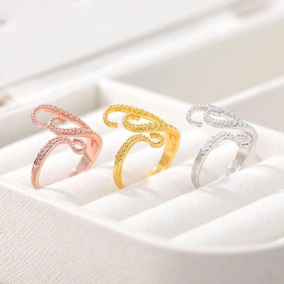 Stunning set of crystal-adorned rings in rose gold, yellow gold, and silver, perfect for enhancing your jewelry collection and making a stylish statement.