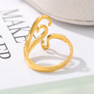 Shiny gold adjustable ring with intricate design, perfect for fashionable accessories and stylish wear. Ideal for gift ideas and special occasions.