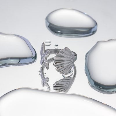 High-quality silver jewelry with shell and starfish motifs, perfect for beach-inspired fashion. Find unique accessories at Monalisa Store for a stylish and trendy look.