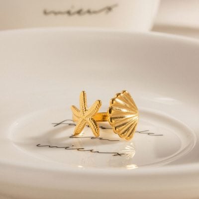 Elegant gold starfish and shell design jewelry, perfect for beachwear and summer accessories. Unique statement ring for women, crafted with high-quality gold material.