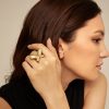 Stylish woman wearing a unique gold butterfly ring, close-up portrait emphasizing jewelry accessories from Monalisa Store’s collection, perfect for luxury jewelry lovers.