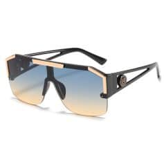 Stylish black and gold designer sunglasses with gradient tinted lenses for UV protection, perfect for fashion-forward optometry customers and enhancing outdoor vision.