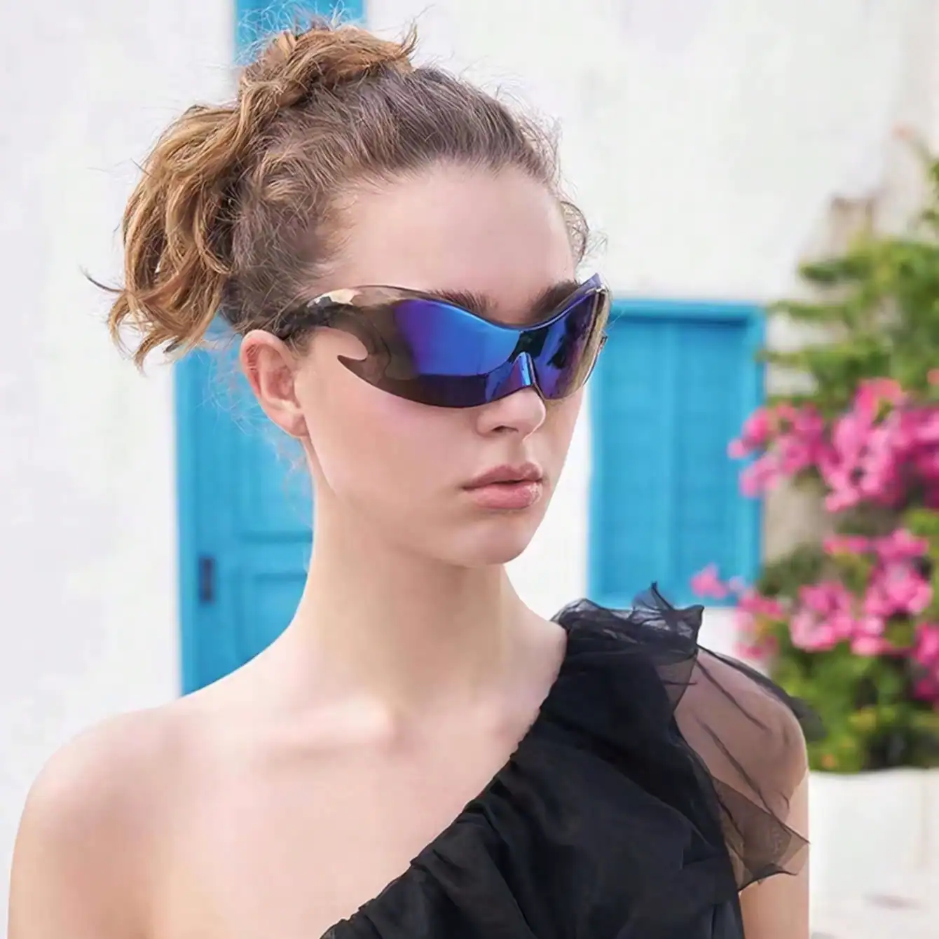 High-tech blue mirrored wraparound sunglasses for women, stylish and UV-protective, perfect for outdoor fashion and sun protection.