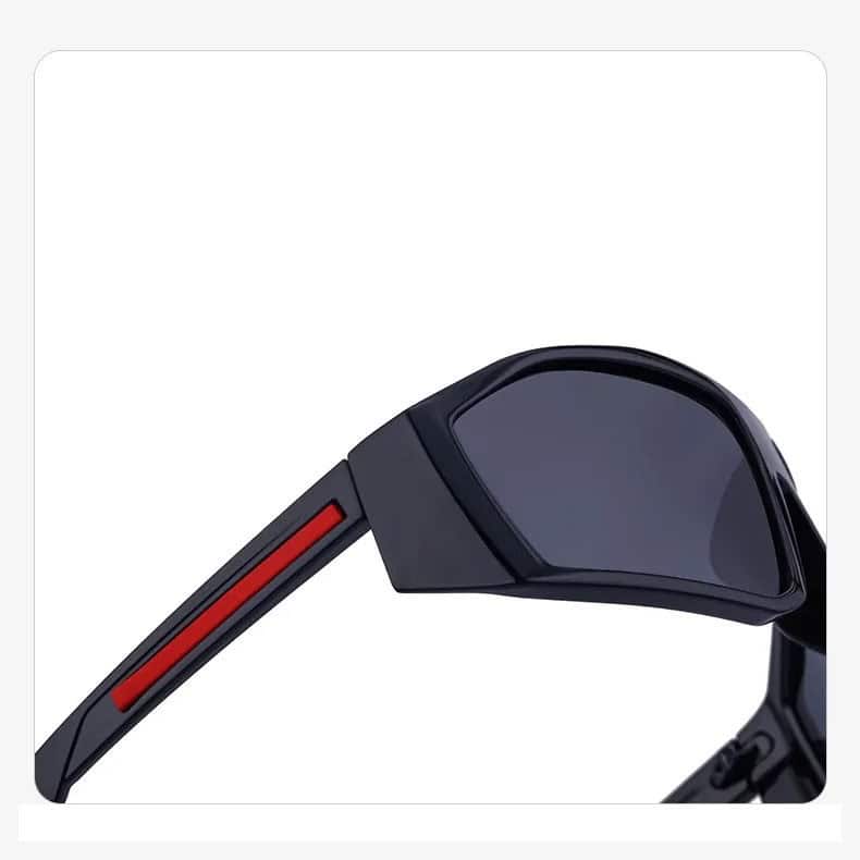 High-quality black sunglasses with red accent on the arm, stylish and durable, perfect for eye protection and fashion statements.