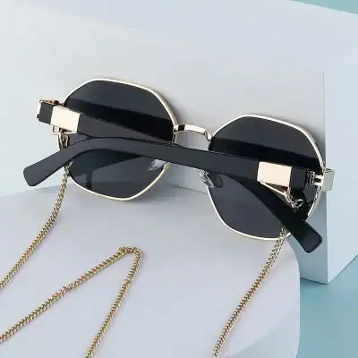 Stylish black sunglasses with gold frame detailing, ideal for UV protection and fashion accessories from Monalisa Store.
