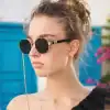 Stylish round sunglasses with transparent chain, perfect for sun protection and fashion statements. Ideal for trendy eyewear enthusiasts looking for quality optical accessories.