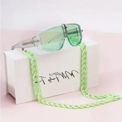 Stylish green-tinted sunglasses with chain strap, perfect for fashionable eye wear and optical fashion accessories at Monalisa Store.