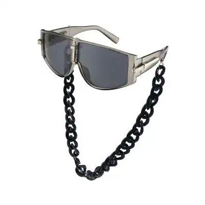Luxury designer sunglasses with chain accessory for style and UV protection.