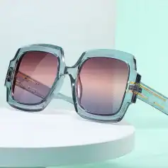 Stylish oversized square sunglasses with gradient tinted lenses, transparent acetate frames, and gold accents, ideal for fashionable sun protection and UV defense.
