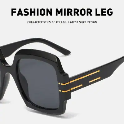 Stylish black sunglasses with mirror lenses, featuring a unique modern design and gold accents for a trendy look. Perfect for fashion-forward individuals seeking premium opt eyewear.
