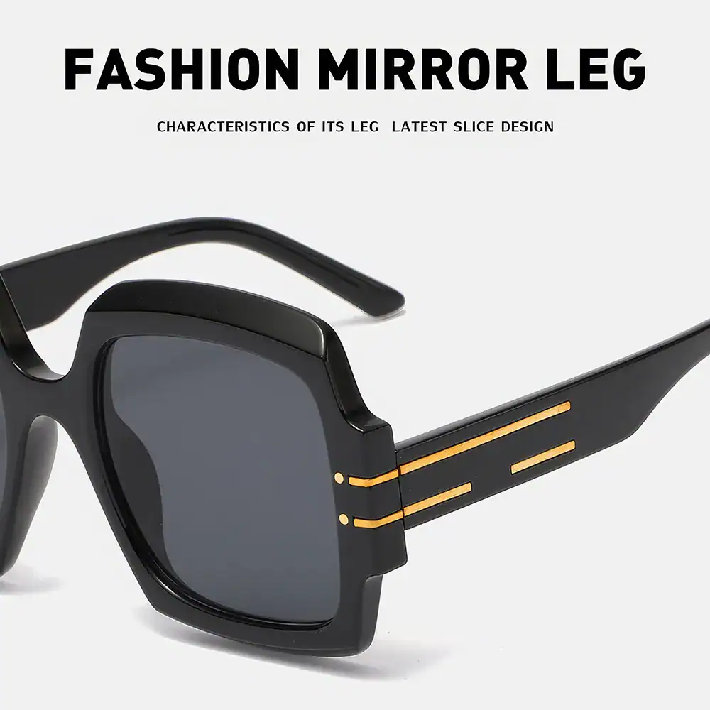 Stylish black sunglasses with mirror lenses, featuring a unique modern design and gold accents for a trendy look. Perfect for fashion-forward individuals seeking premium opt eyewear.