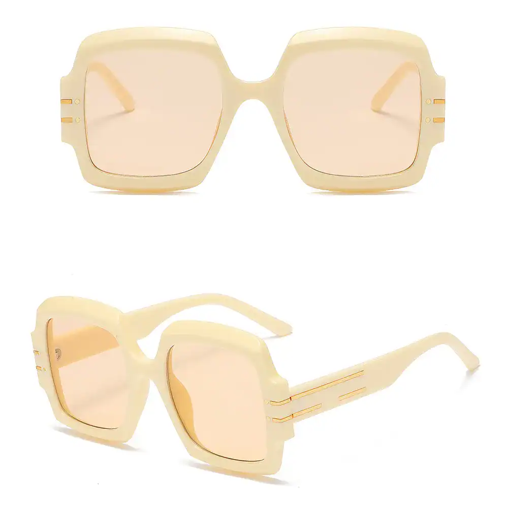 Stylish oversized sunglasses with light beige frames and tinted lenses, perfect for sun protection and fashion statements.