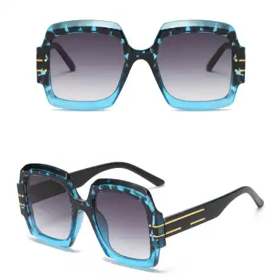 High-quality designer sunglasses with bold blue and black pattern, gradient tinted lenses, perfect for fashion and eye protection. Shop Monalisa Store for stylish eyewear.