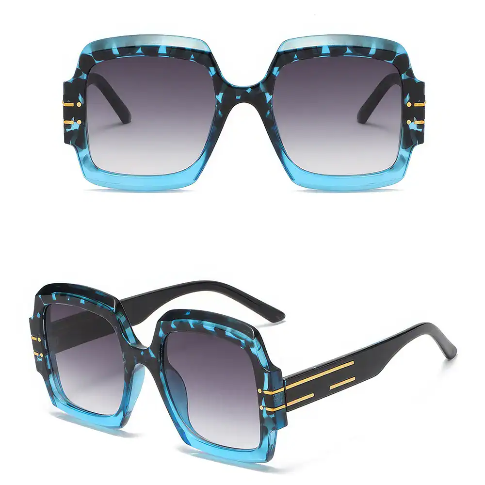 High-quality designer sunglasses with bold blue and black pattern, gradient tinted lenses, perfect for fashion and eye protection. Shop Monalisa Store for stylish eyewear.