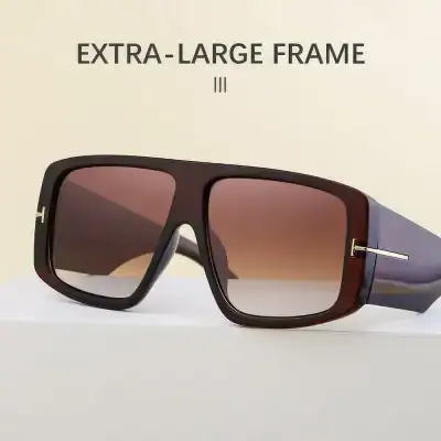 High-quality extra-large sunglasses with a stylish black and brown frame, perfect for sun protection and fashion statement. Features UV protection and polarized lenses for outdoor activities.