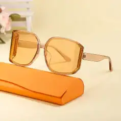 Bold orange sunglasses with oversized square frames and polarized lenses, perfect for fashion-forward sun protection and eye care needs.