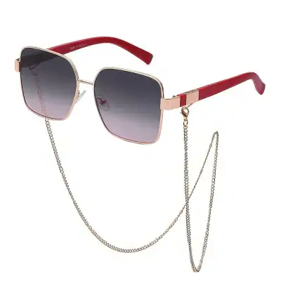 Elegant square sunglasses with tinted lenses and gold frame, featuring a decorative chain for a fashionable look, ideal for sun protection and style.