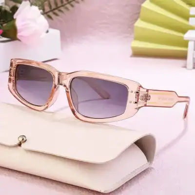 Elegant pink transparent sunglasses with dark lenses, perfect for stylish sun protection and summer fashion.