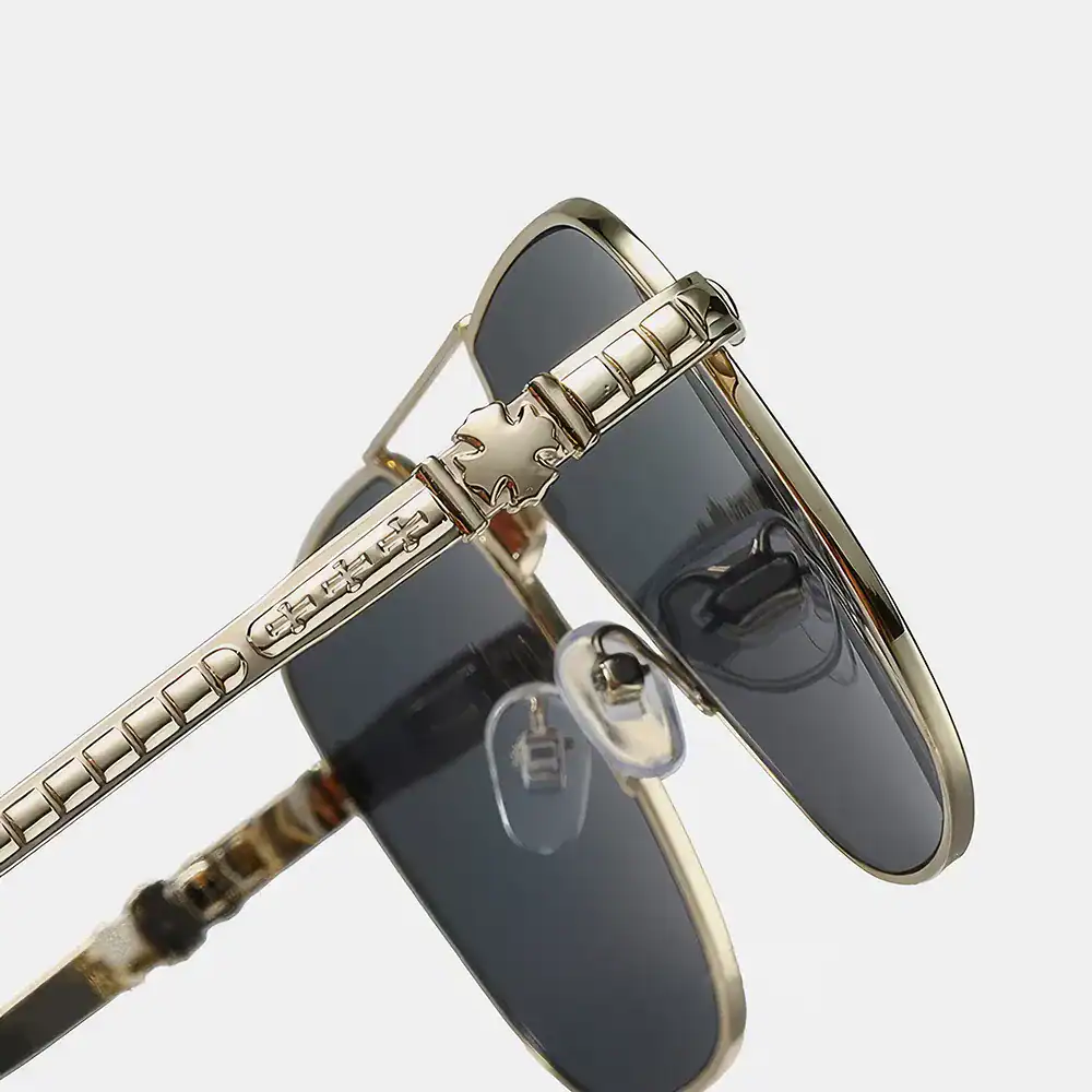 Stylish luxury sunglasses featuring gold-toned details and tinted lenses, perfect for fashion-forward individuals seeking high-end eyewear at Monalisa Store.